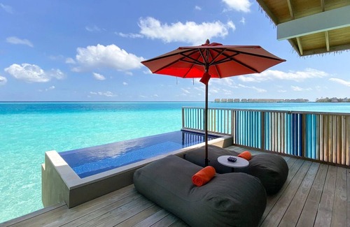 Farukolhufushi Island Hotel | Dive into Music: Overwater Villas & Underwater Tunes Await You!