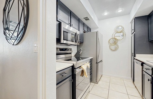 Baristo Condo | Dive into Palm Springs fun with a stylish home base featuring poolside lounging.