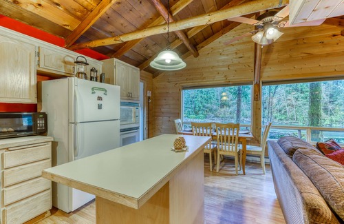 Gold Bar Cottage | Dog-friendly cottage on the river with private hot tub, mountain views & firepit