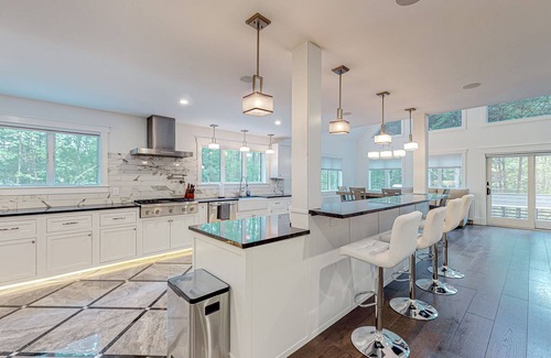 Dixfield House | Dog-friendly riverfront retreat with two decks, washer/dryer, Ping-Pong, & AC
