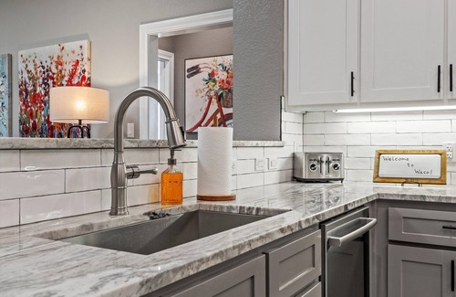 Brazos Condo | Downtown Waco retreat! 2 blocks to Magnolia Silos! Huge private balcony!