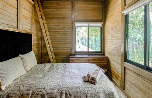 Tulum Cabin | Eco-luxe jungle cabin with furnished patio, lanai, partial AC, & on-site cafe