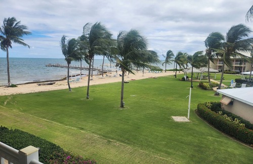 Crystal Harbour Apartment | Elegant 1BR Oceanview Suite w/Full Kitchen, Bar & Relaxing Pool Area