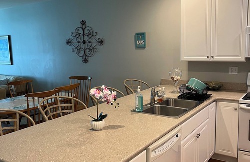 Lewes Condo | Elegant and cozy beach condo for your family vacation with pool and pond