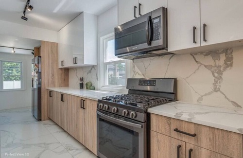Elmhurst House | Elegant Haven: 4BR/3BA Retreat