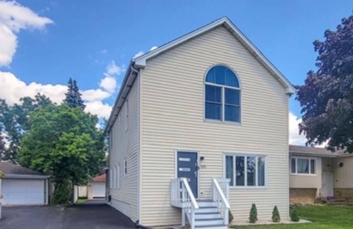 Elmhurst House | Elegant Haven: 4BR/3BA Retreat
