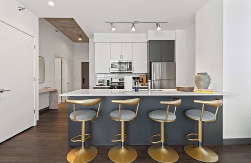 The Loop Apartment | Elevated 2BR Retreat + Balcony with Bean Views