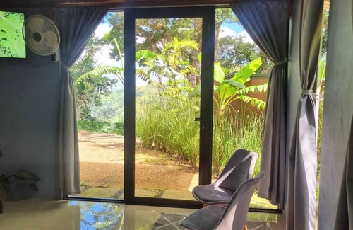 Monteverde House | Encantadora villa con vista al atardecer y al valle.