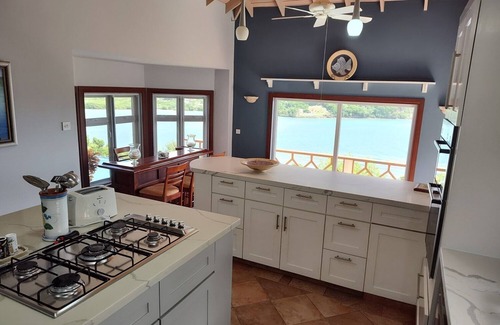Arawak Hill Villa | Enjoy the tropical breezes & coral reef views while sitting by the pool!
