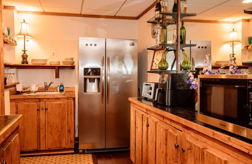 Asheville Apartment | Enjoy a beverage while viewing the Blue Ridge Mountains from the heated pool!