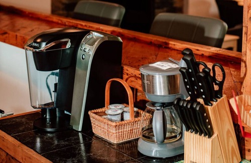 Asheville Apartment | Enjoy a beverage while viewing the Blue Ridge Mountains from the heated pool!