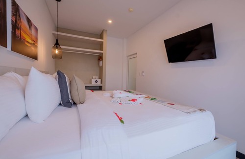 San Pedro Hotel | Enjoy a gorgeous master suite with a full kitchen, king bed, and balcony!