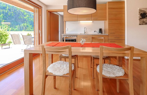 Bizau Apartment | Enjoy a lovely break close to nature in this holiday apartment with access to a pool and sauna.