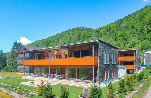 Bizau Apartment | Enjoy a lovely break close to nature in this holiday apartment with access to a pool and sauna.