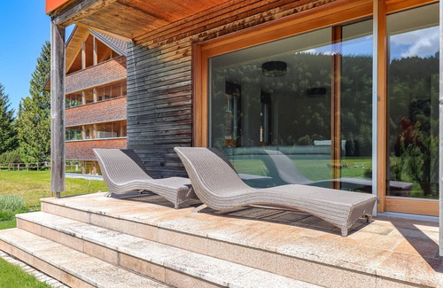Bizau Apartment | Enjoy a lovely break close to nature in this holiday apartment with access to a pool and sauna.