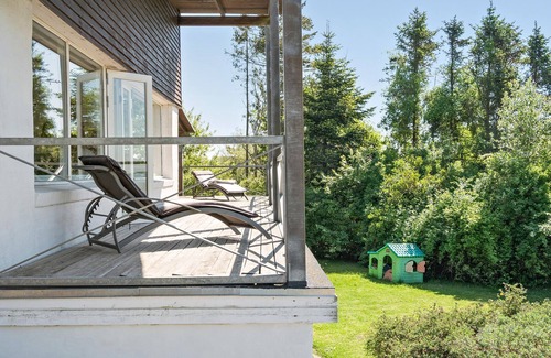 Daugard House | Enjoy a relaxing holiday in this holiday home with sea views near Vejle Fjord.