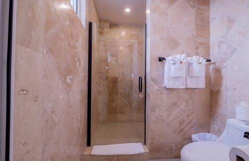 San Pedro Hotel | Enjoy gorgeous views of the island through a private balcony!