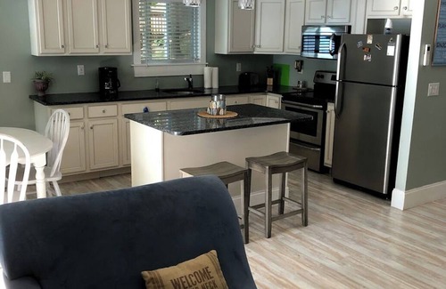 Port Douglass House | Enjoy Modern Amenities and Fun on the Water with Kayaks & Paddle Boat