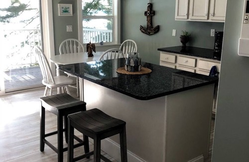 Port Douglass House | Enjoy Modern Amenities and Fun on the Water with Kayaks & Paddle Boat