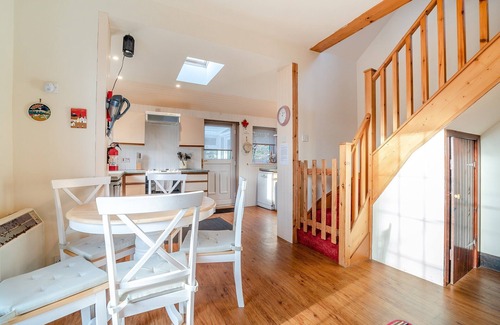 Corrie Cottage | Enjoy stunning sea views from this traditional cottage on the coast of Arran.