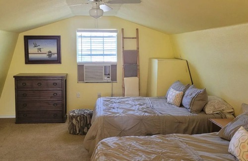 Dennis Cottage | Enjoy the river with a pool, firepit and a balcony with a gorgeous water view.