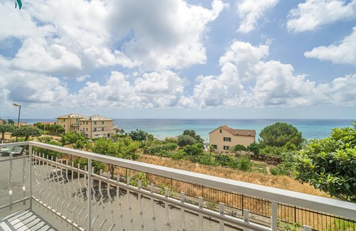 Cogoleto Apartment | Enjoy the view of the blue sea and the nearby beach with your family.