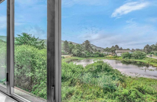 Rockaway Beach House | Escape to a cozy, modern lake house with beautiful Oregon views.