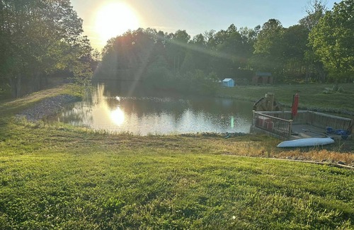 Hamptonville Cottage | Escape to a Hobbit cottage overlooking a pond with water wheel in wine country!