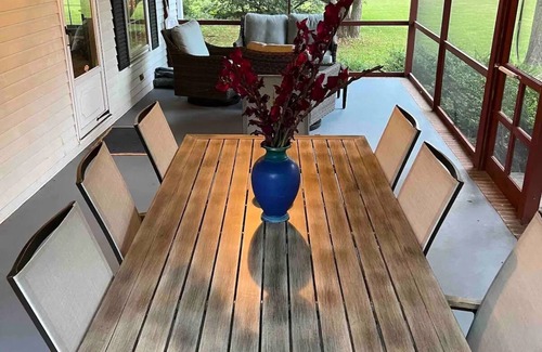Cambridge House | Escape with family or friends to this peaceful, 4-bedroom retreat on the water