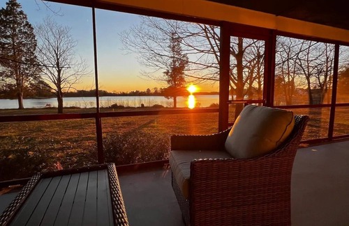 Cambridge House | Escape with family or friends to this peaceful, 4-bedroom retreat on the water