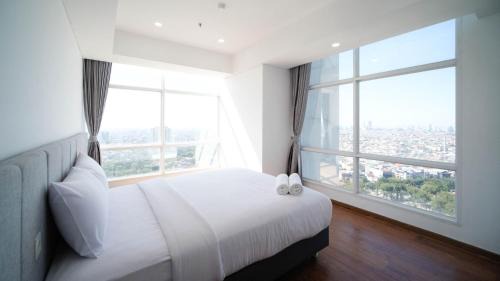 Surabaya Apartment | Exclusive and Spacey 3BR at Grand Sungkono Lagoon Apartment By Travelio
