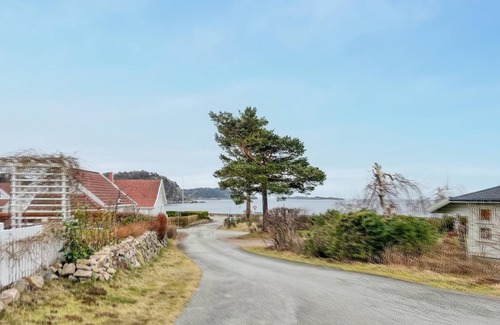 Spangereid House | Experience a real Norwegian vacation atmosphere in this vacation home by the fjord.