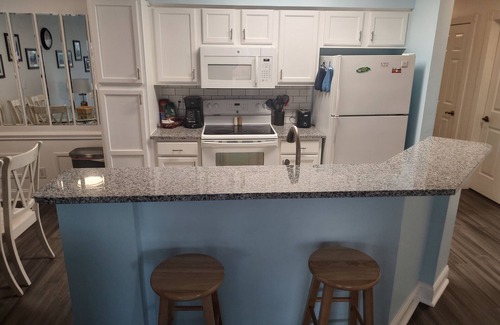 Sunset Beach Condo | Extra large first floor condo with indoor & outdoor pools, close to the beach.