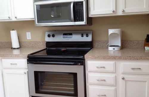 Oldsmar Condo | family friendly, gated community, two pools, lake outside back door.
