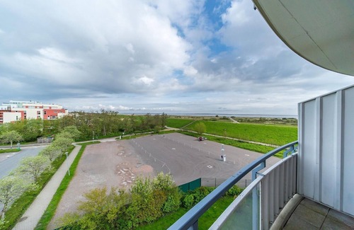 Schillig Apartment | Family-friendly vacation apartment close to the beach with balcony and North Sea view - Hus