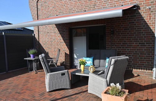 Papenburg House | Feel-good vacation home with a view of the natural lake from the terrace