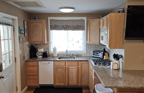 Wildwood Crest Condo | FEEL THE OCEAN BREEZE ON THE LARGE PORCH WHILE ENJOYING YOUR FAVORITE BEVERAGE