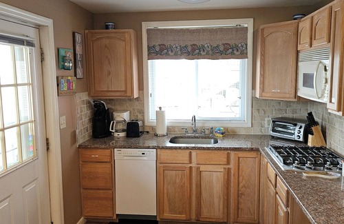 Wildwood Crest Condo | FEEL THE OCEAN BREEZE ON THE LARGE PORCH WHILE ENJOYING YOUR FAVORITE BEVERAGE