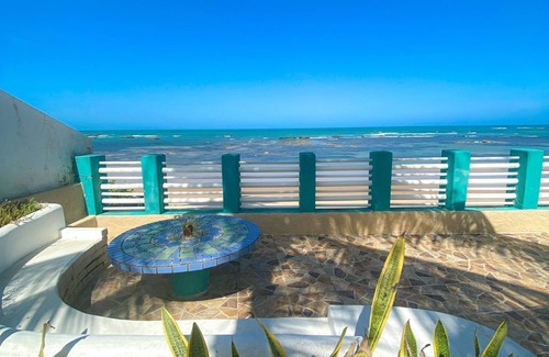 Petropolis Ski Chalet | Feet in the sand at Garça beach in Maceió-AL