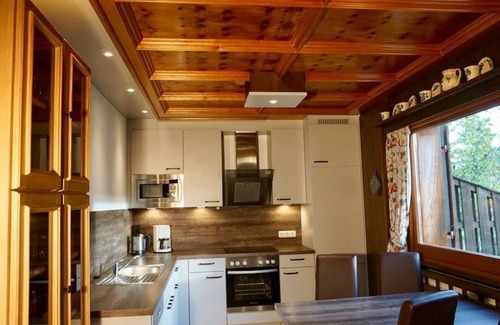 Schwarzenbach House | Ferienhaus 09-e mit Kachelofen - Ferienhäuser im Feriendorf Weissensee im Allgäu