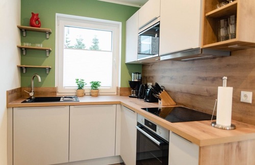 Tannenhausen House | Ferienhaushälfte Wasserseite - Küsten Apartments Tannenhausen