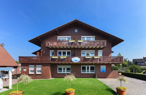 Neuharlingersiel Apartment | Ferienwohnung Polaris - Haus Hafenromantik in Neuharlingersiel