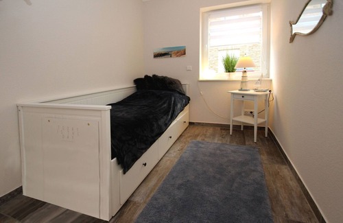 Neßmersiel Apartment | Ferienwohnung in Neßmersiel mit Garten und Feldblick