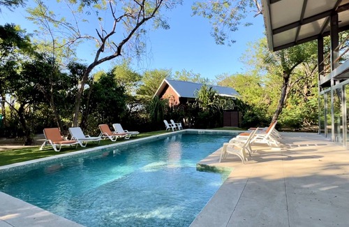 Playa Grande House | Five Bungalows, Swimming Pool and Amenities Amidst a Beachfront Forest.