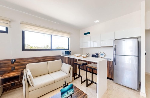 Zama Apartment | Fourth-floor studio with rooftop pool, partial A/C, city views, & balcony