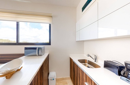 Zama Apartment | Fourth-floor studio with rooftop pool, partial A/C, city views, & balcony