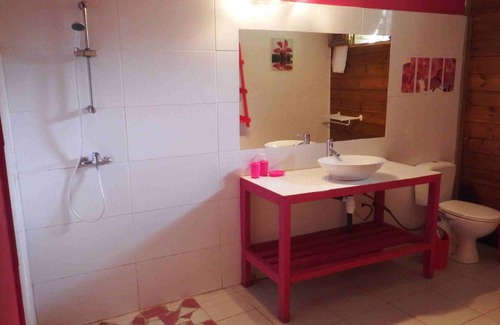 Deshaies Apartment | Fuchsia apartment in a postcard setting overlooking the Caribbean Sea