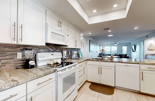 South Padre Island Condo | Fully Renovated Getaway with Beachfront Patio - Steps to Pool & Hot Tub