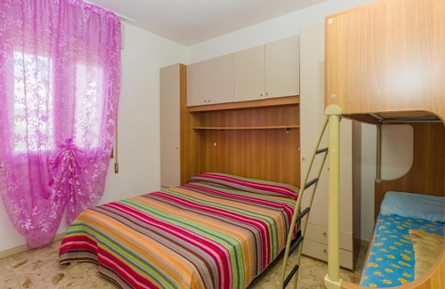 Bibione Pineda Apartment | Gabbiano tree-room flat surrounded by the green of the quite pine forest