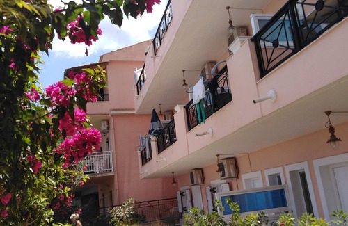 Benitses Apartment | Galini Sea Apartment 3 at the Beach with Wi-Fi, A/C & Garden